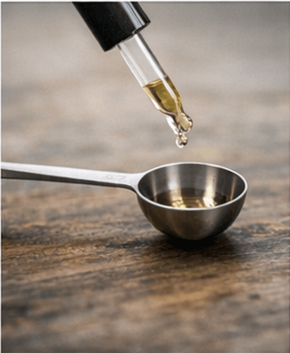 A dropper carefully measuring a precise dose