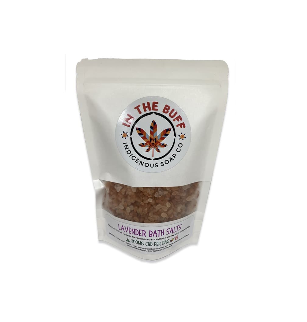 Lavender CBD bath salts in a jar with purple lavender flowers and calming therapeutic spa elements