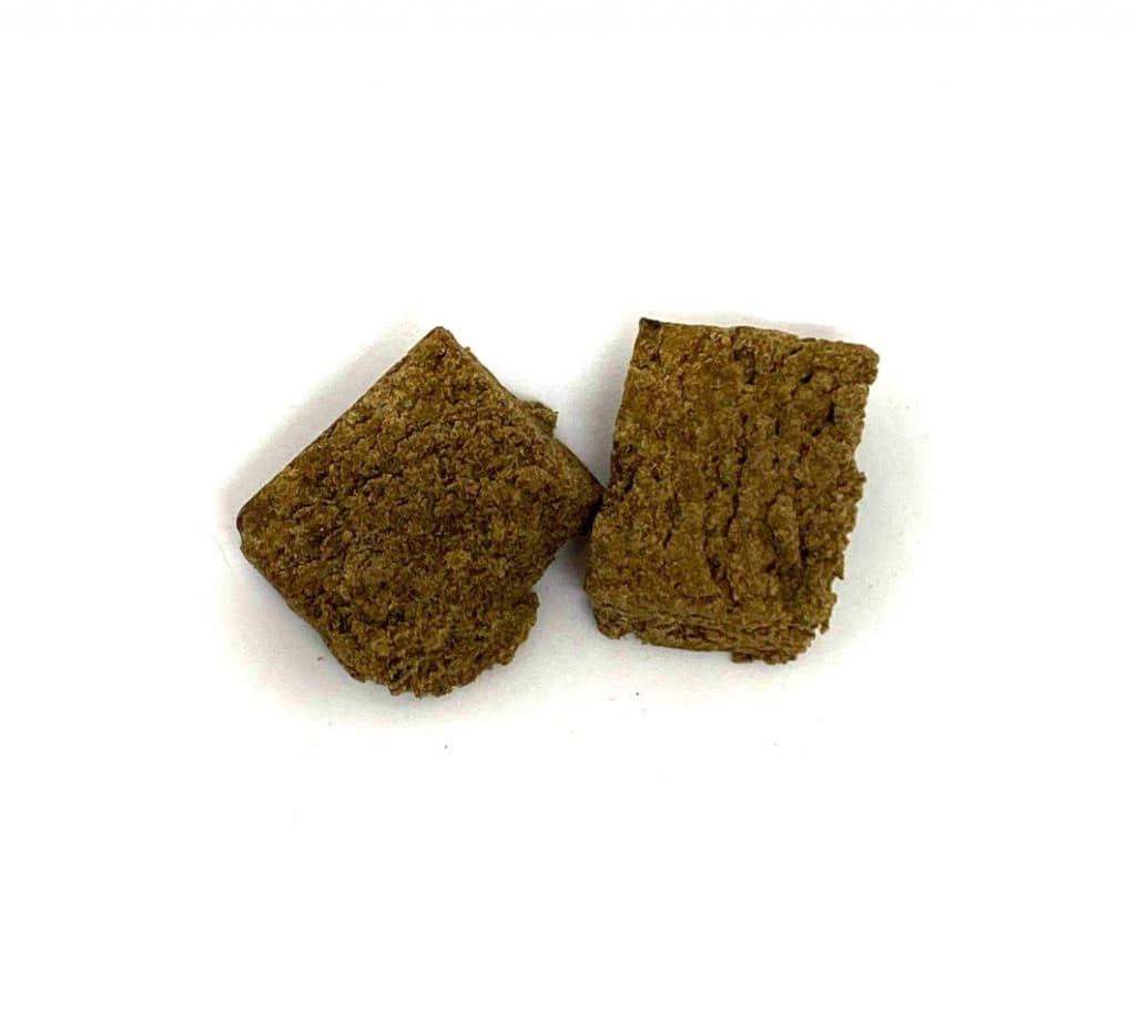 Pink Kush bubble hash concentrate, dark amber pressed cannabis extract