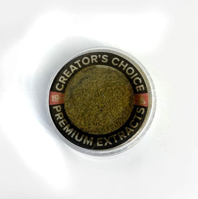 Traders Choice cannabis kief concentrate golden powder with 42 percent THC potency in small container