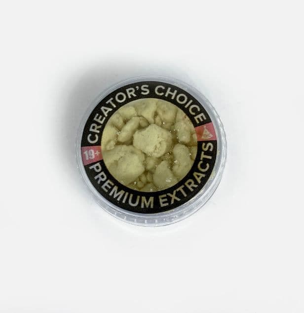 White water soluble THC powder concentrate in a small container showing fine crystalline texture for easy dissolution