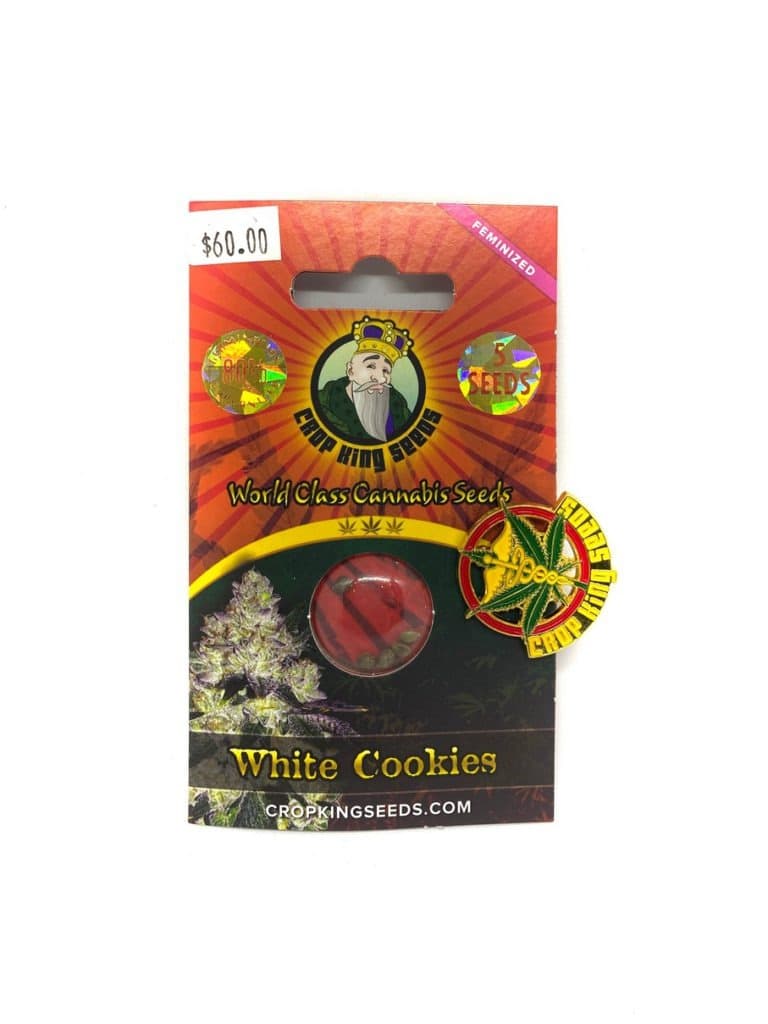 White Cookies cannabis seeds in a small pile or packet, showcasing premium quality seeds from a trusted seed company