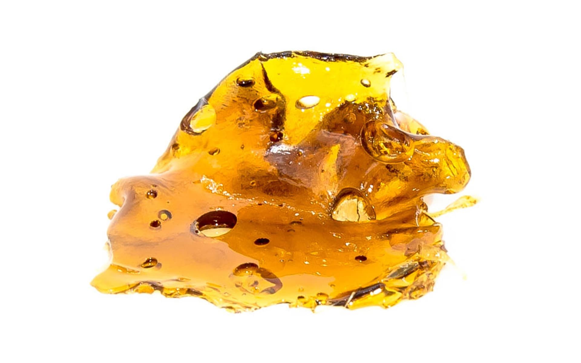Creators Choice Shatter cannabis concentrate golden amber translucent slab close-up product shot