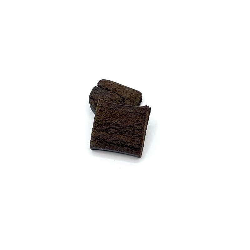 Dark brown Moroccan hash block with rich resinous texture, traditional handpressed cannabis concentrate
