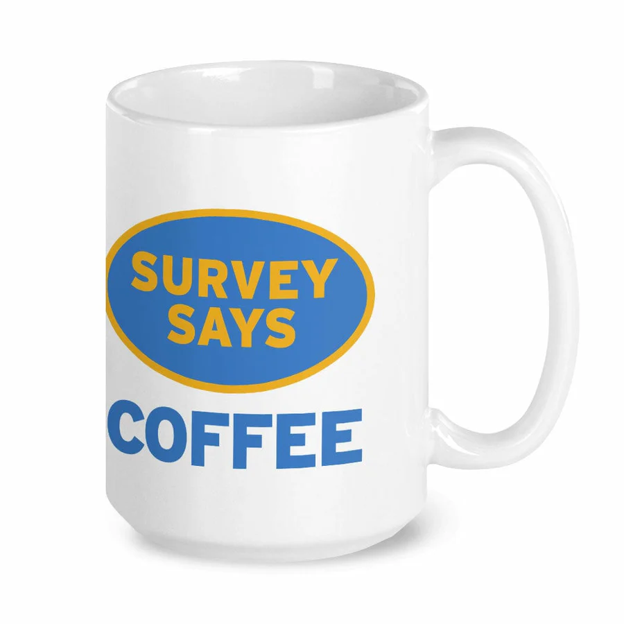 White ceramic coffee mug with Survey Says text printed on the front