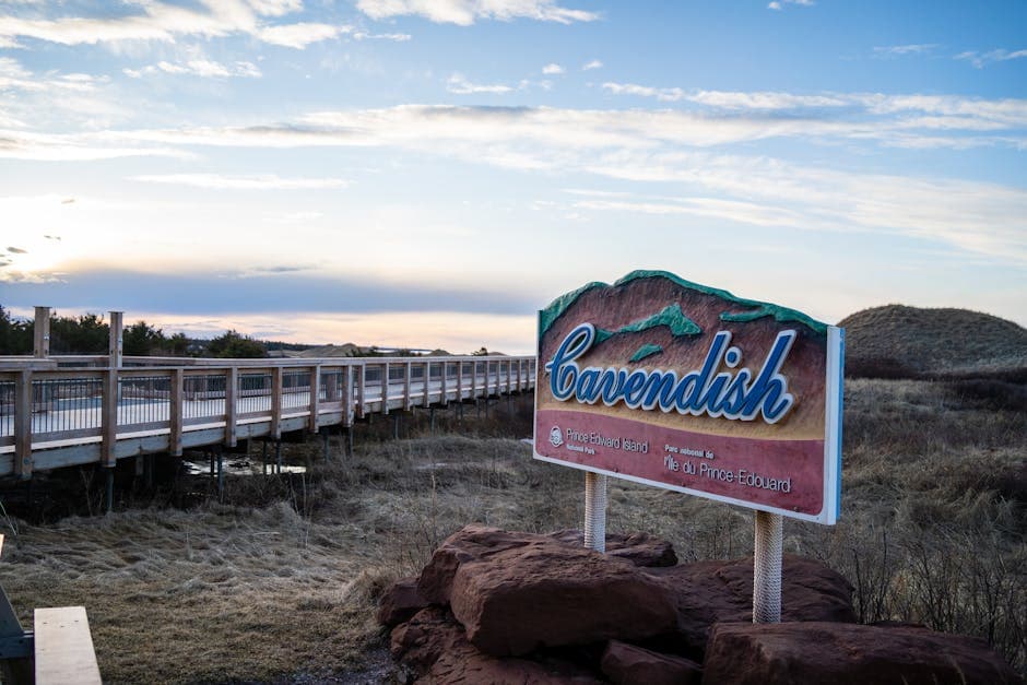 Cavendish sign by boardwalk under blue skies in Prince Edward Island Canada