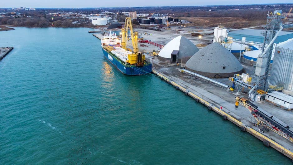 Aerial view of a cargo ship docked at the industrial Port of Oshawa Canada