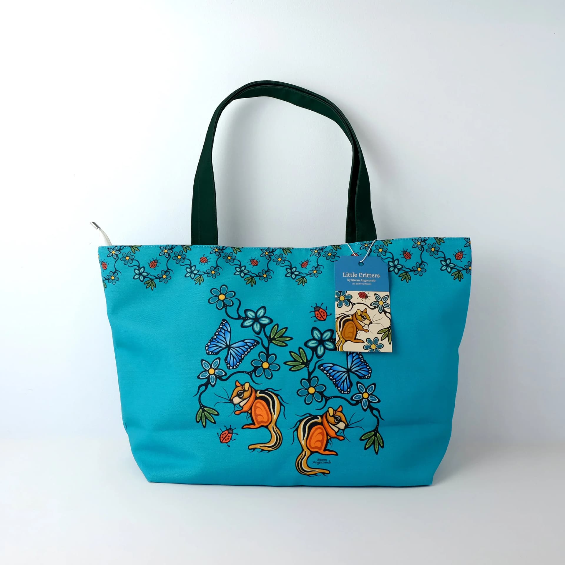 Teal tote bag featuring little critters pattern in storm blue tones by Angeconeb