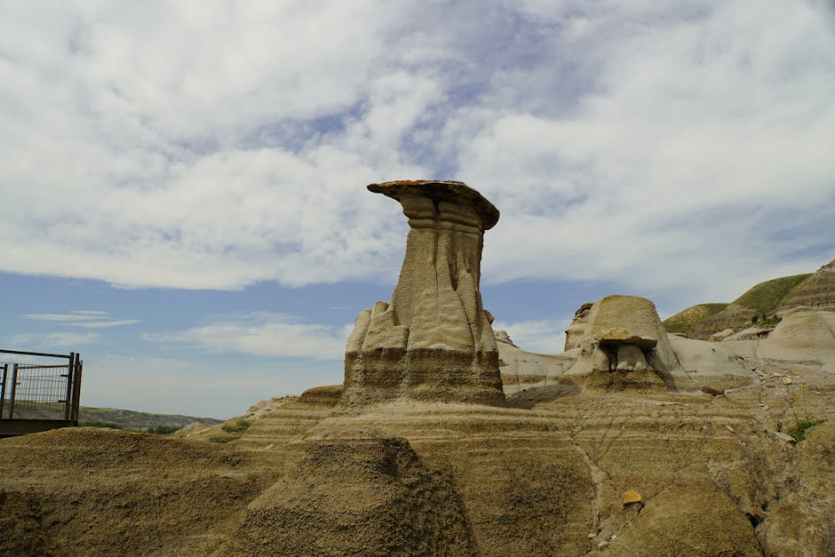 Capture the breathtaking rock formations, known as hoodoos, in the dramatic landscape of Drumheller Badlands.
