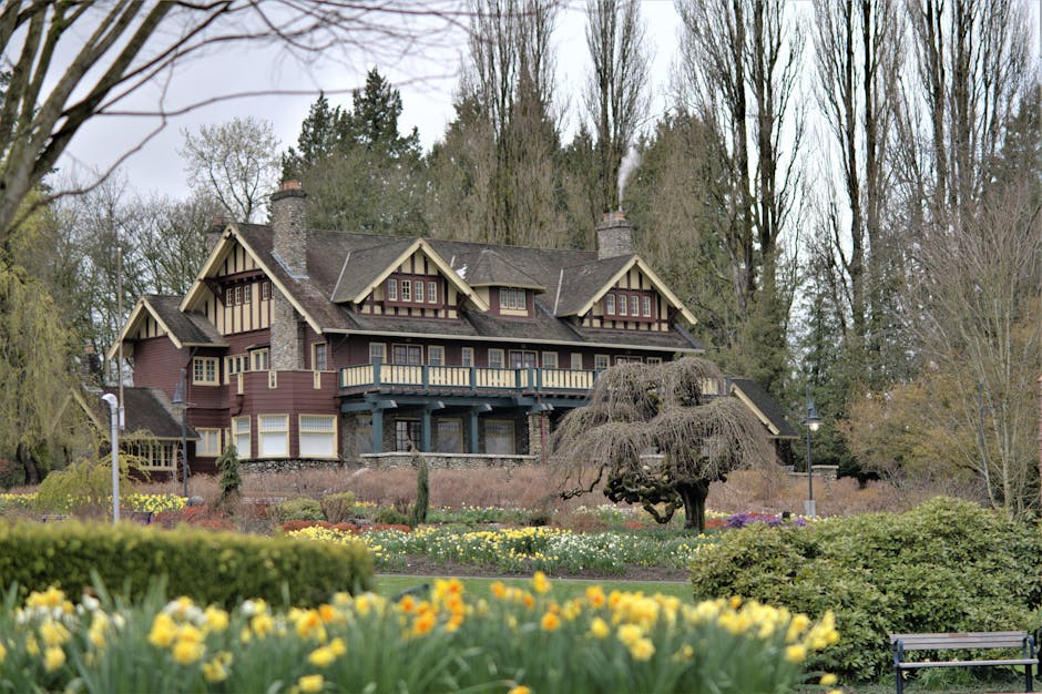 Beautiful view of Burnaby Art Gallery surrounded by vibrant spring flowers and lush greenery.
