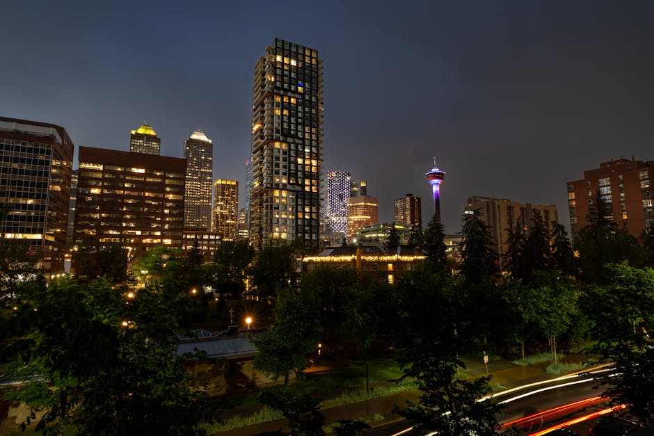 Stunning night view of Calgary's modern skyline featuring the illuminated Calgary Tower and skyscrapers.
