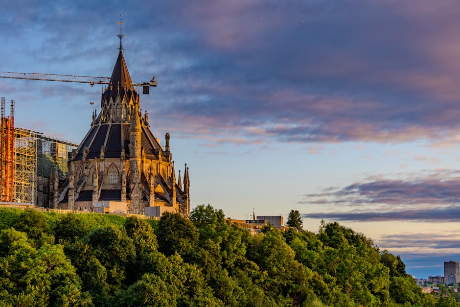 Stunning view of Ottawa's Library of Parliament against a vibrant sunset sky.