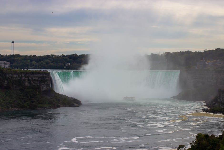 A stunning view of Niagara Falls with mist rising, shot from Ontario, Canada.